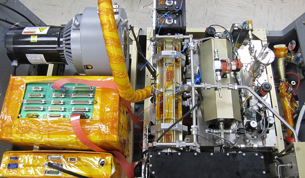 
        The WI-ICOS instrument that will be part of DCOTSS. The black enclosure at the bottom of the picture is the laser pressure vessel that houses the JPL-developed laser. 
    