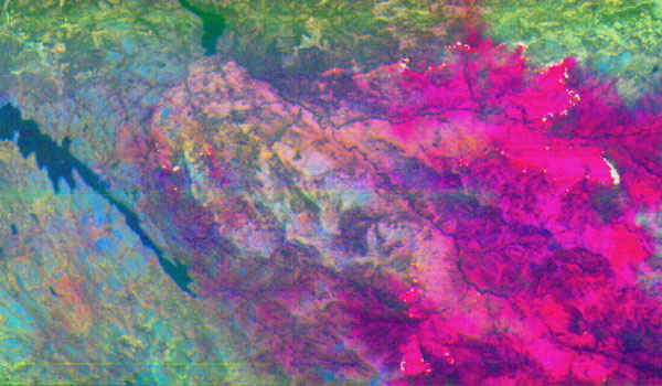 
        Ammonia filled plumes (in Magenta) emitting from fires in Northern California (August 9, 2018). Imagery taken at 65K feet on NASA’s ER-2.
    