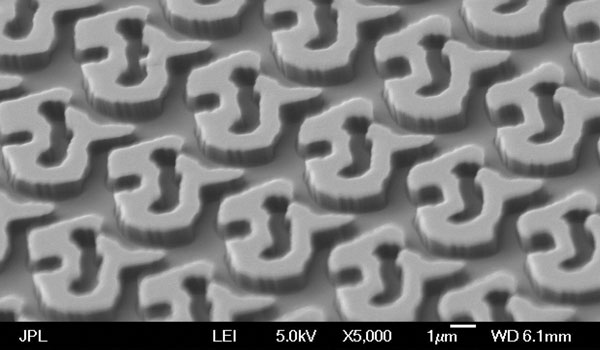 
        Scanning electron microscope image of the seven-by-seven spot array grating.
    