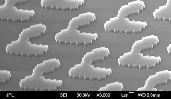 
        Scanning electron microscope image of the three-by-three spot array grating.
    