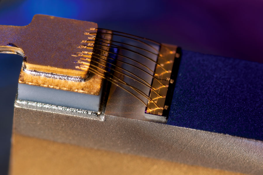 
       Close up view of a junction side up 2-mm laser. A copper C-block and eutectic Au/Sn solder was used to attach the die. 
    